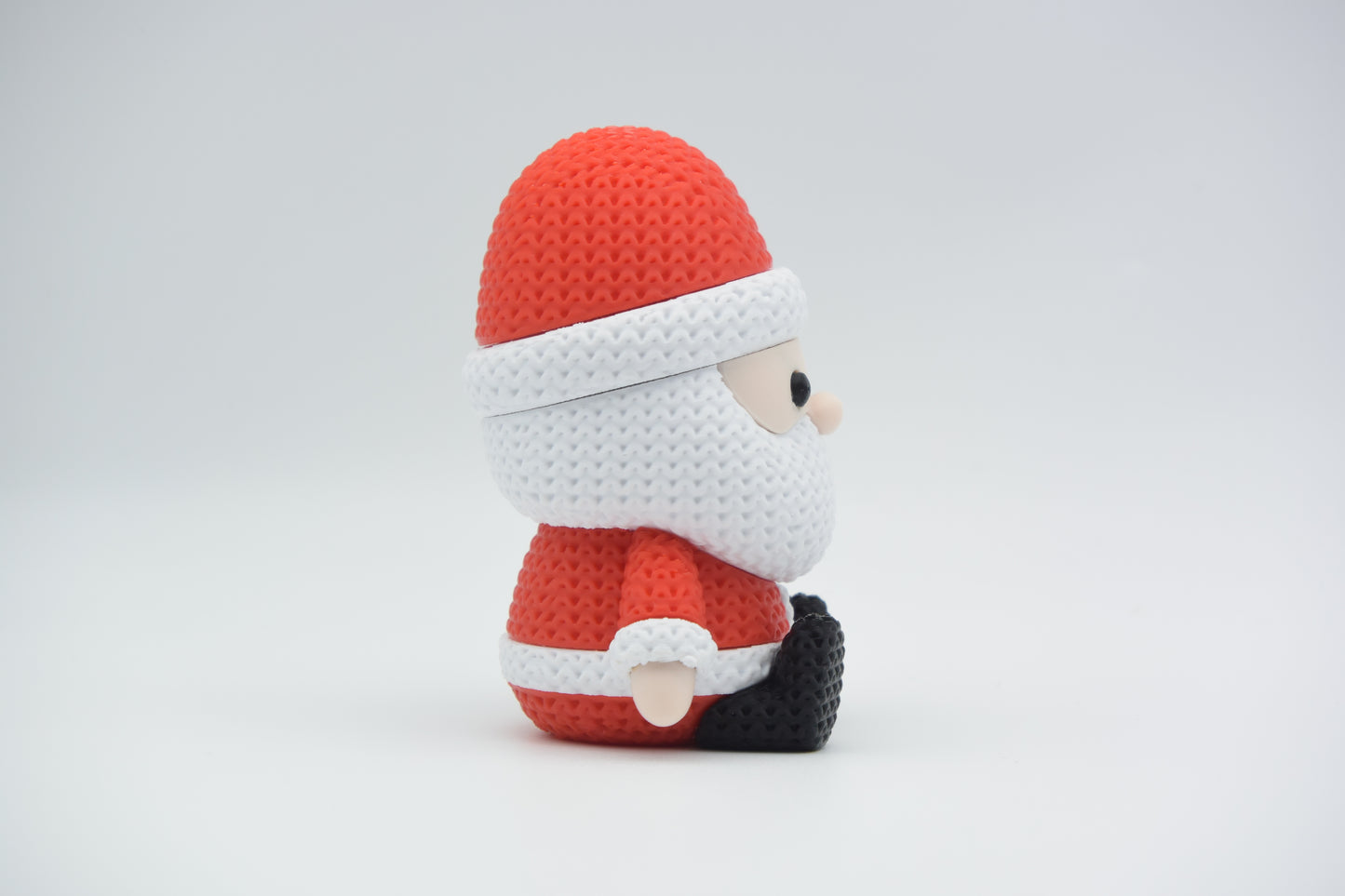 Pletený sediaci Santa Claus